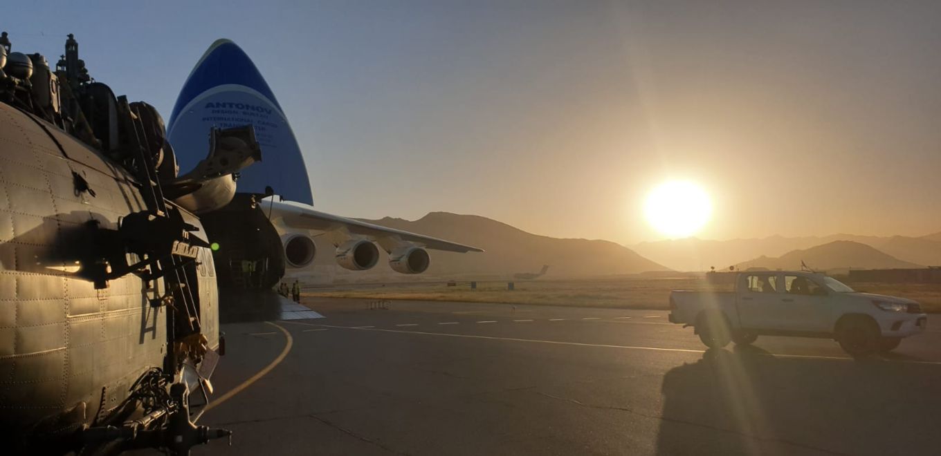 Image shows RAF Puma helicopter being loaded into an Antonov AN-225 aircraft.
