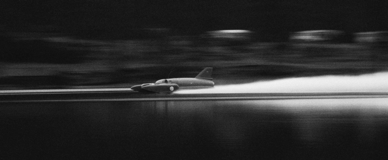 Image shows a black and white photo of the Bluebird boat.