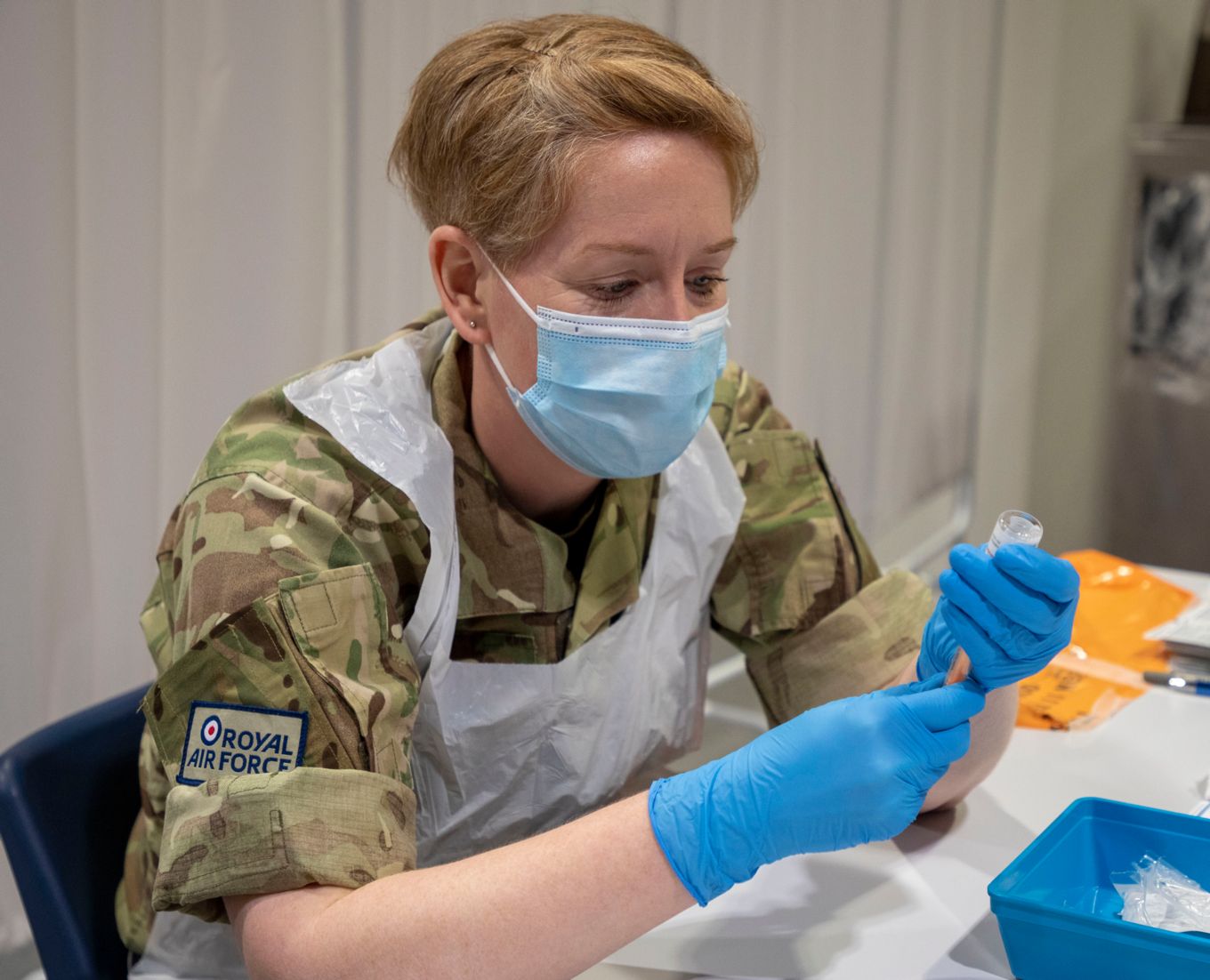 Image shows RAF personnel at a COVID vaccination centre.