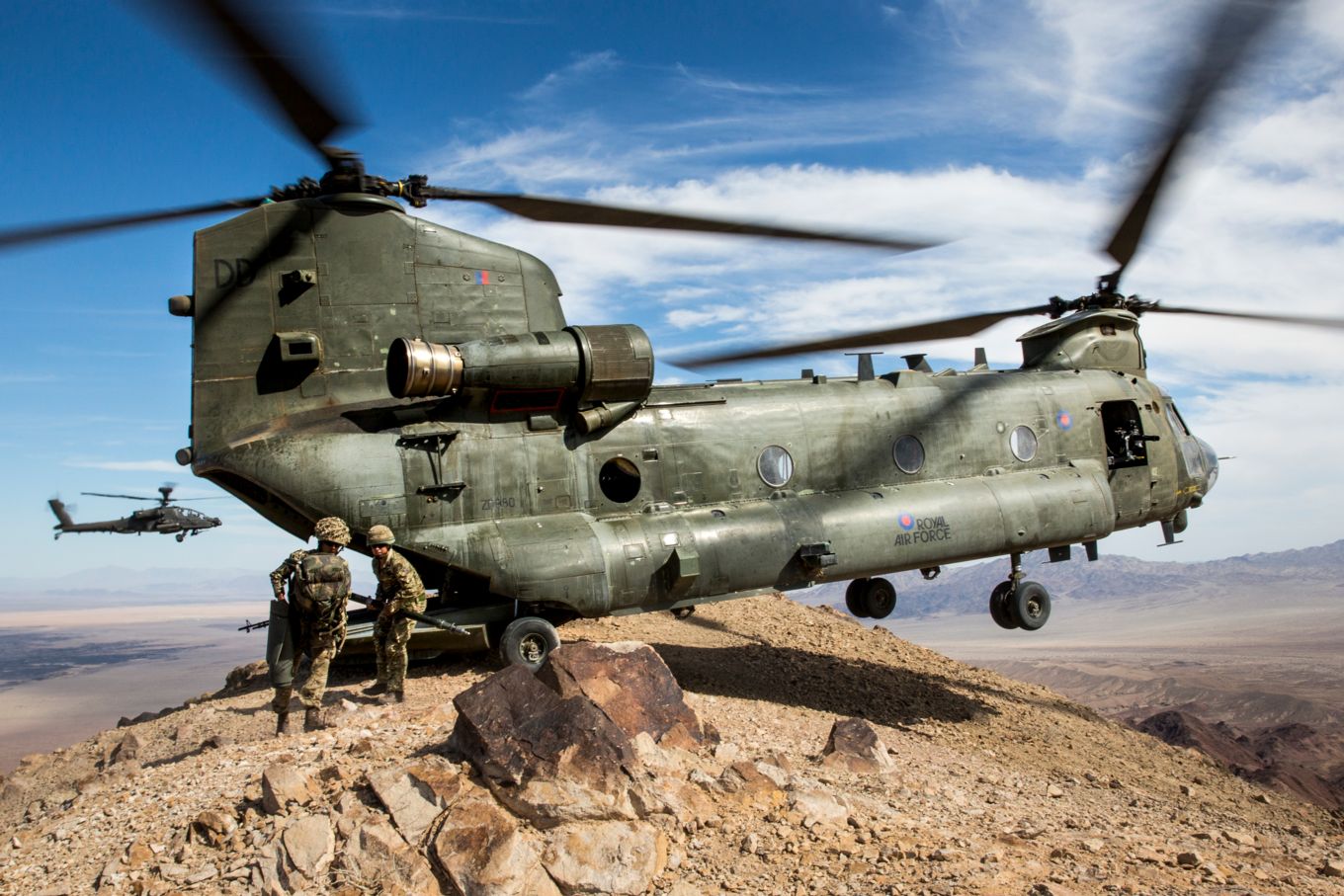 Image shows an RAF Chinook on the edge of a hill side