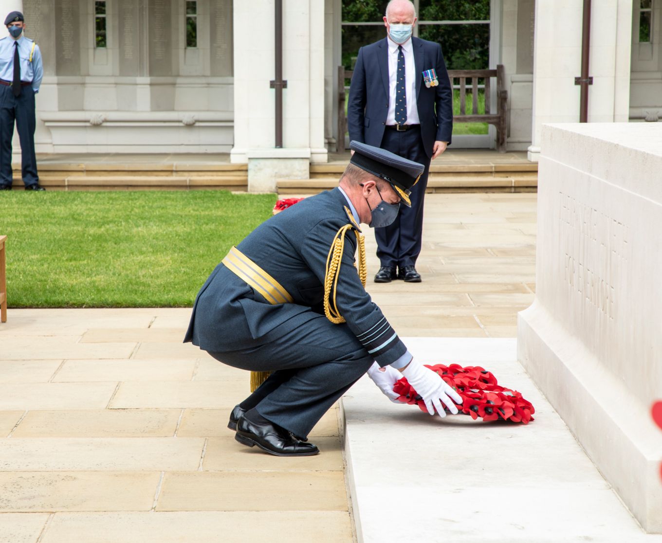 Image shows the Chief of the Air Staff, Air Chief Marshal Sir Mike Wigston laying a wreath.