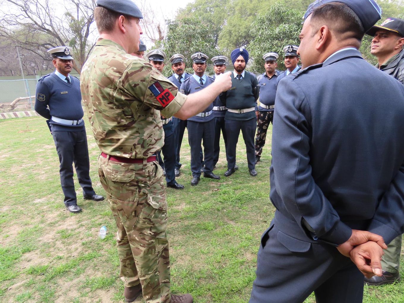 Image shows RAF personnel talking with Indian Air Force personnel.