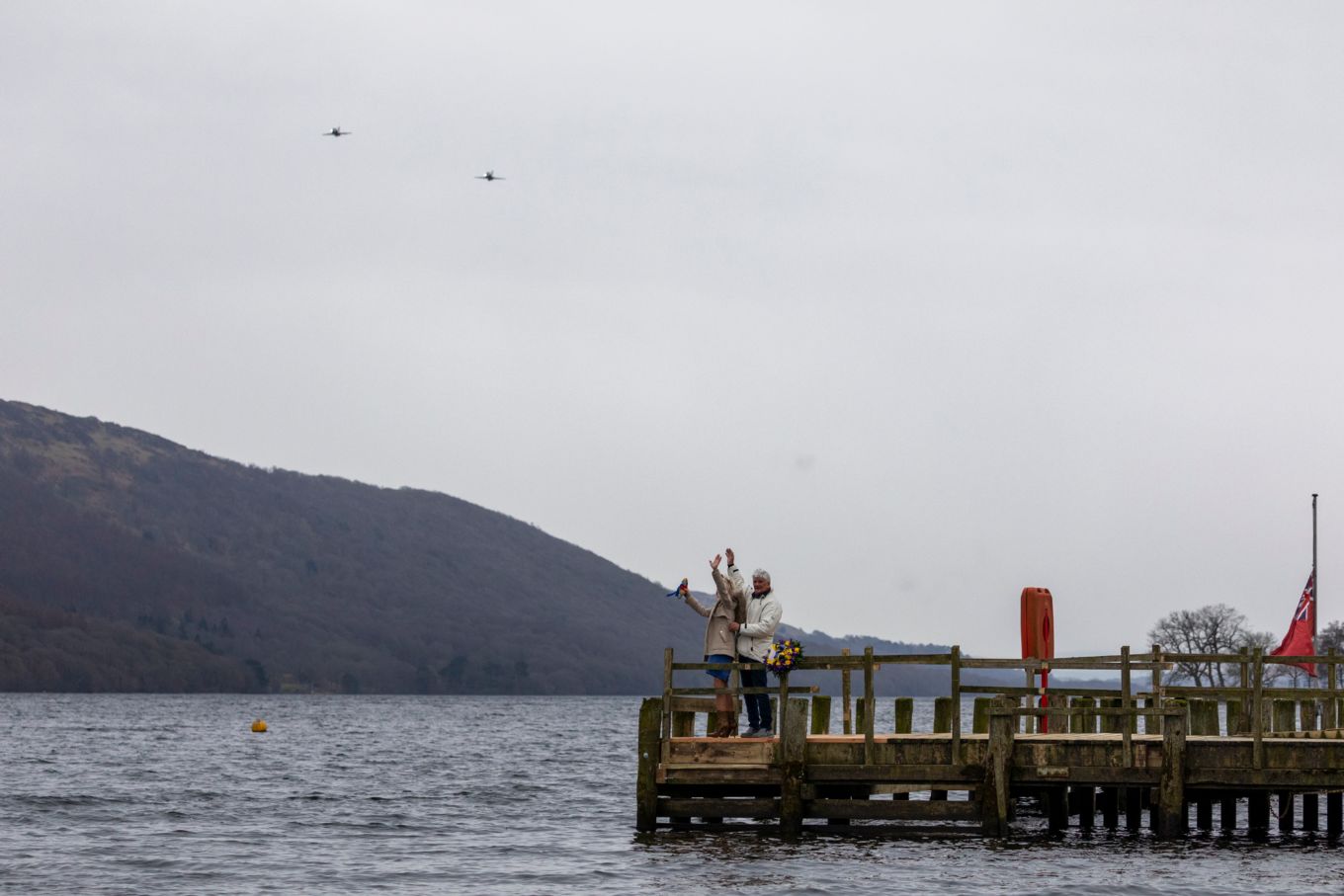 Image shows two RAF Hawk T2 aircraft flying over Coniston Water.