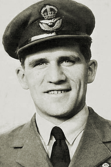 Image shows a black and white photo of Ken Rees.
