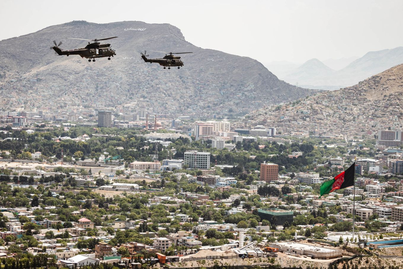 Two Pumas fly over Kabul.