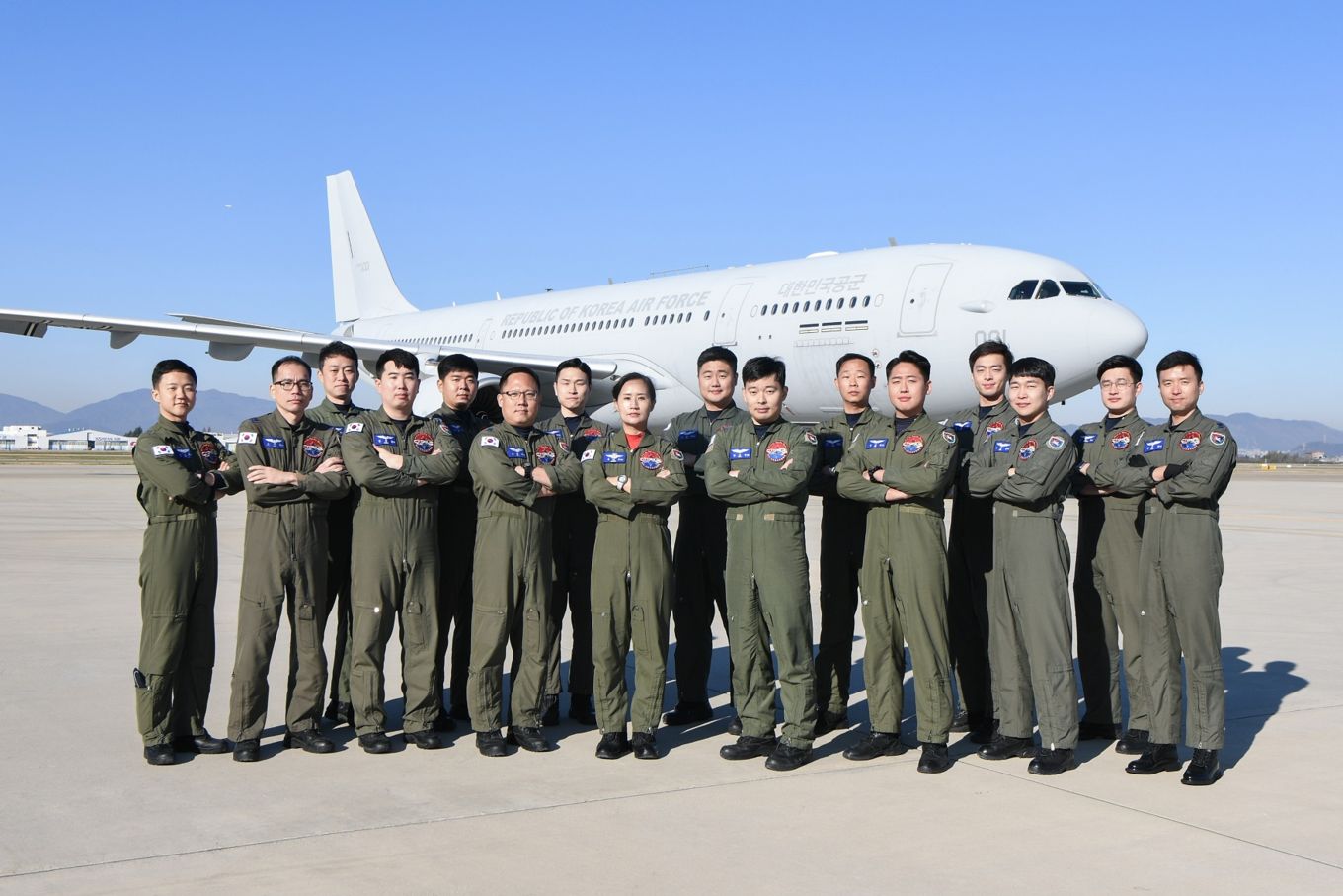 Personnel from the 261 Squadron of the Republic of Korea Air Force stand in-front of the Airbus Tanker Aircraft. 