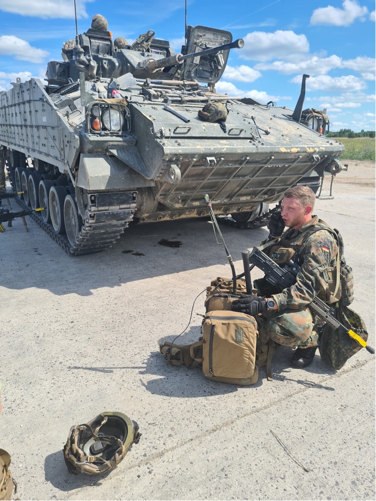 Heavy armoured tank with Joint Terminal Attack Controllers Personnel.