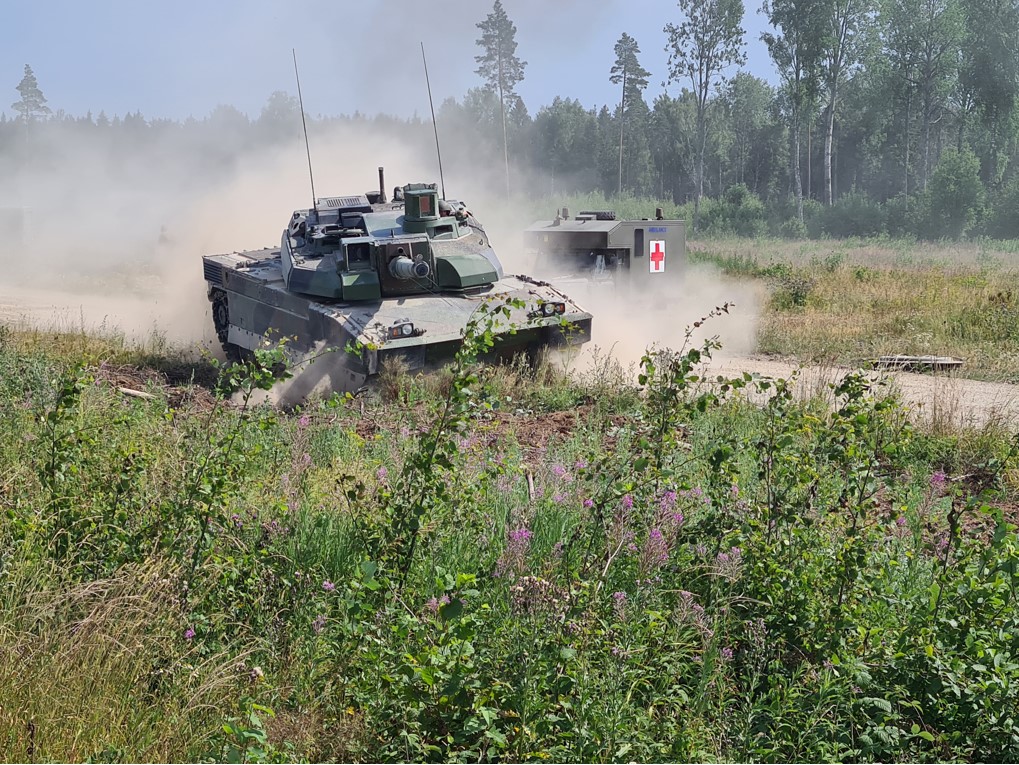 Heavy armoured tank and emergency vehicle.