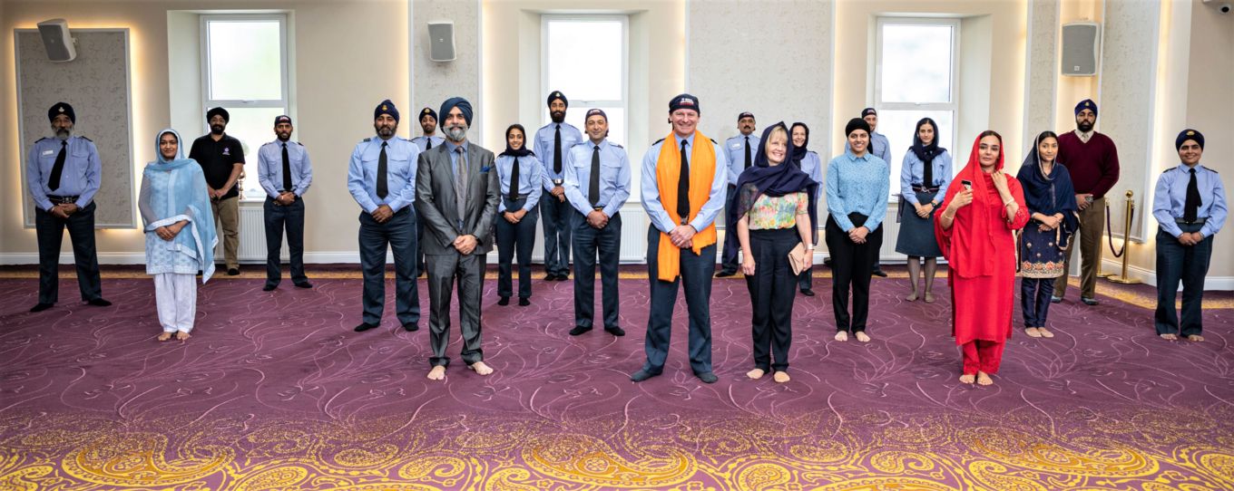 Personnel and members of the Sikh community in the temple. 