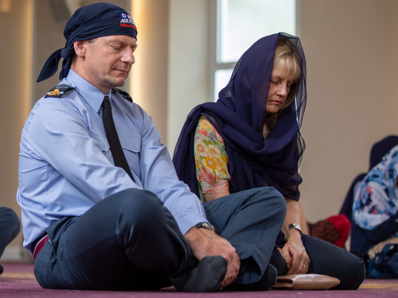 Chief of Air Staff sits cross legged in the temple. 