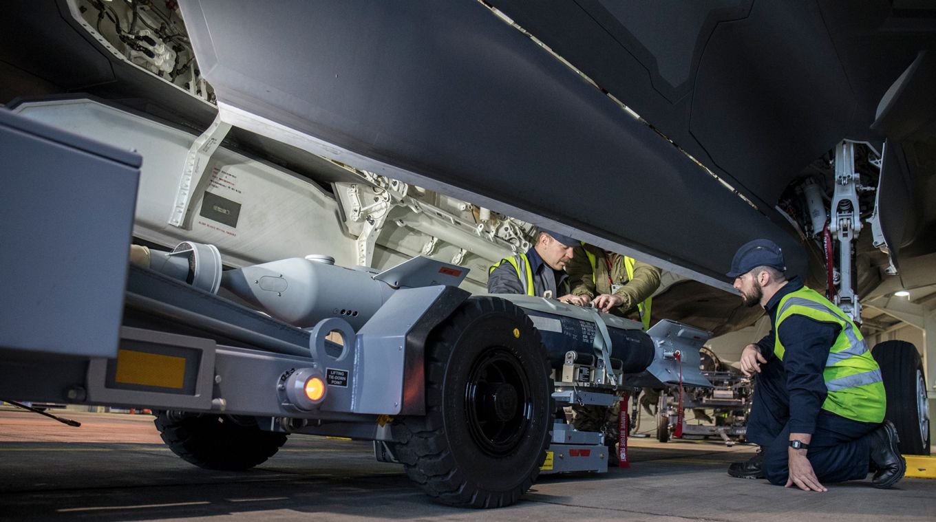 Image shows engineers loading weapons to an RAF F-35.