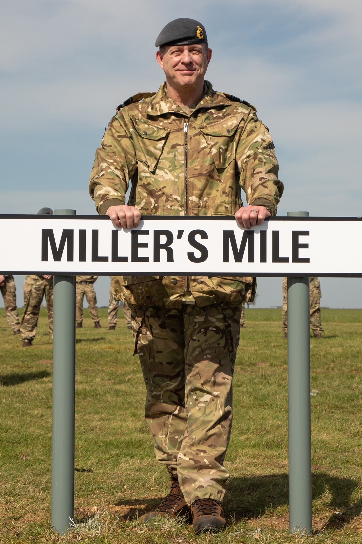 Air Commodore Miller with the Miller Mile road sign