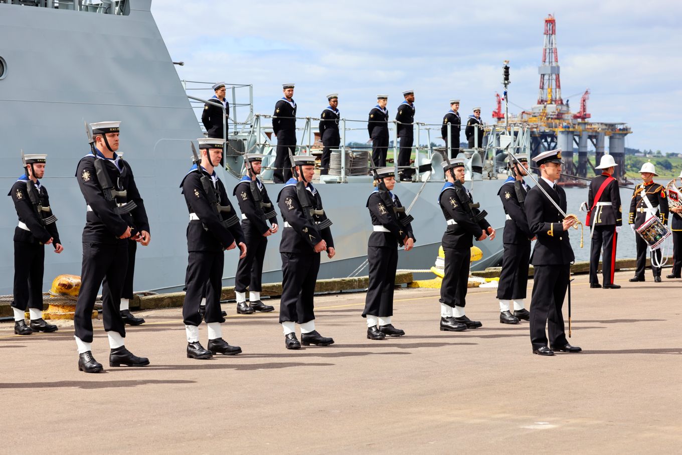 Royal Navy stand outside HMS Spey.