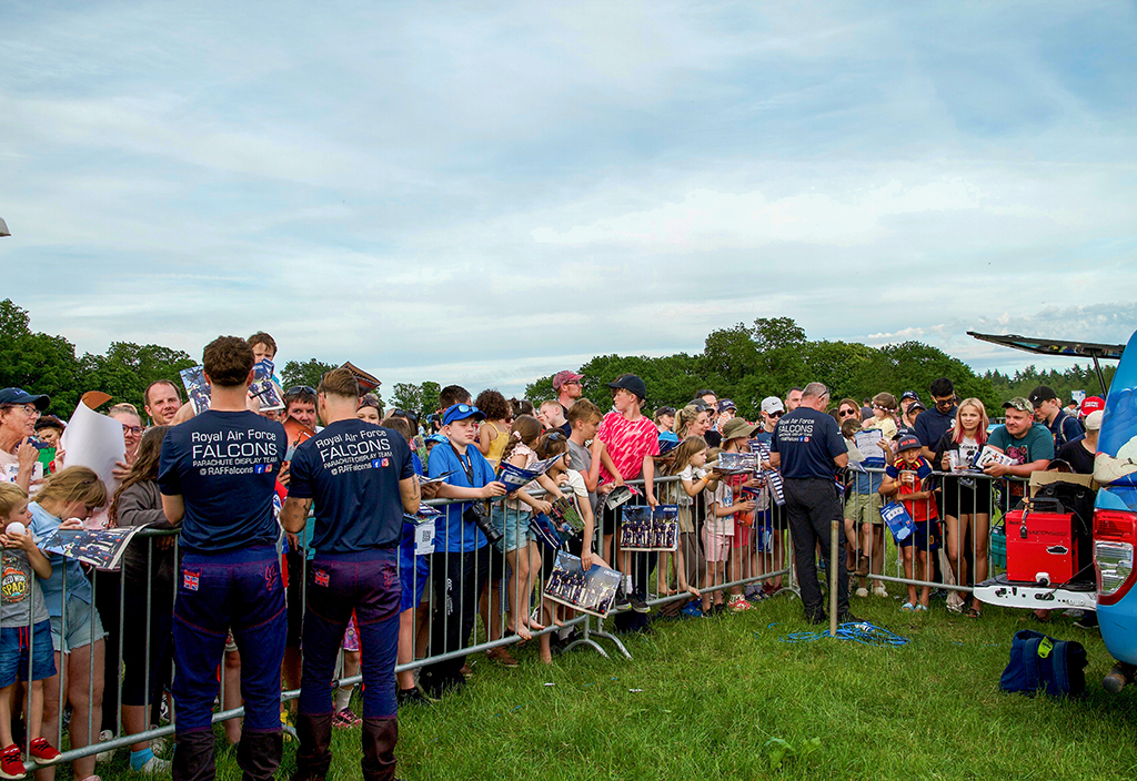 Three of the RAF Falcons Parachute Display Team are seen here engaged with the public, meeting visitors, answering questions and inspiring the next generation to consider careers in Defence.
