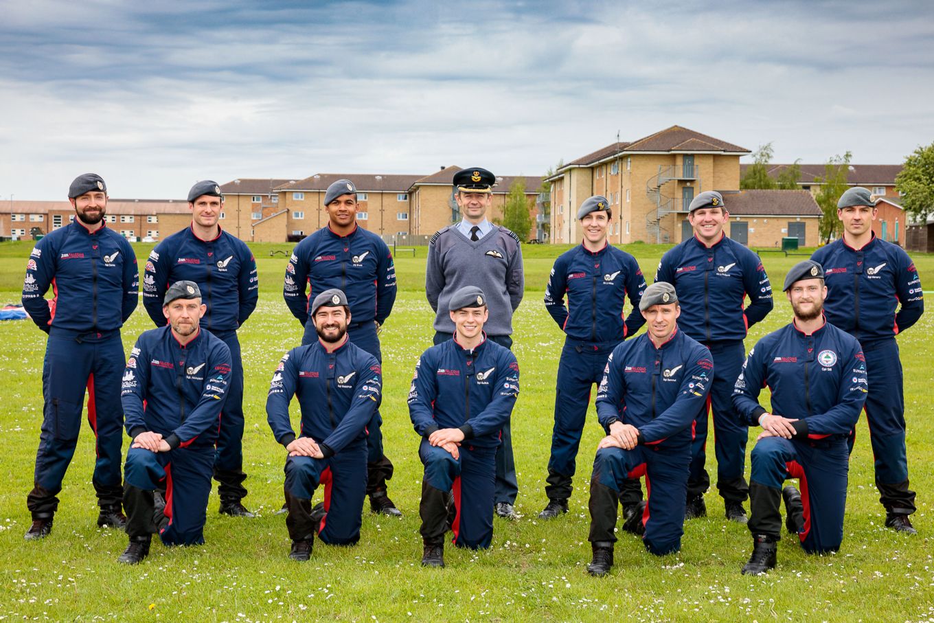 Pictured, the 2021 RAF Falcons Parachute Display Team with Group Captain Simon Blackwell, Commander Air Wing