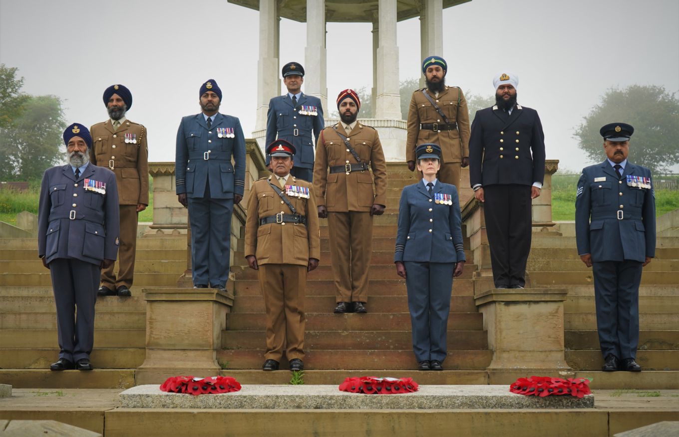 Personnel group picture by the Chattri Memorial and wreaths.
