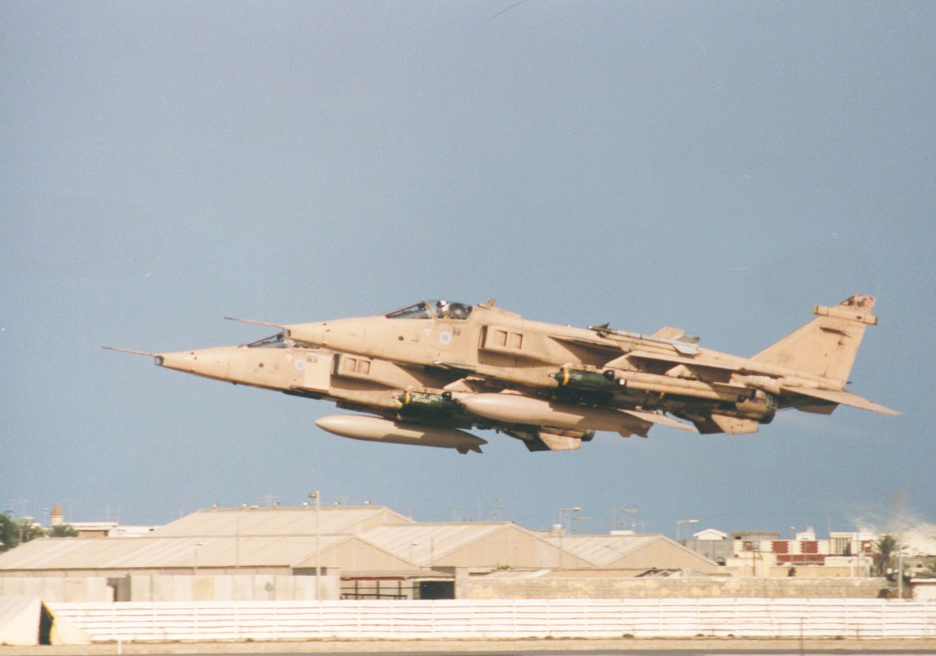 Image shows two RAF Jaguar aircraft taking off.