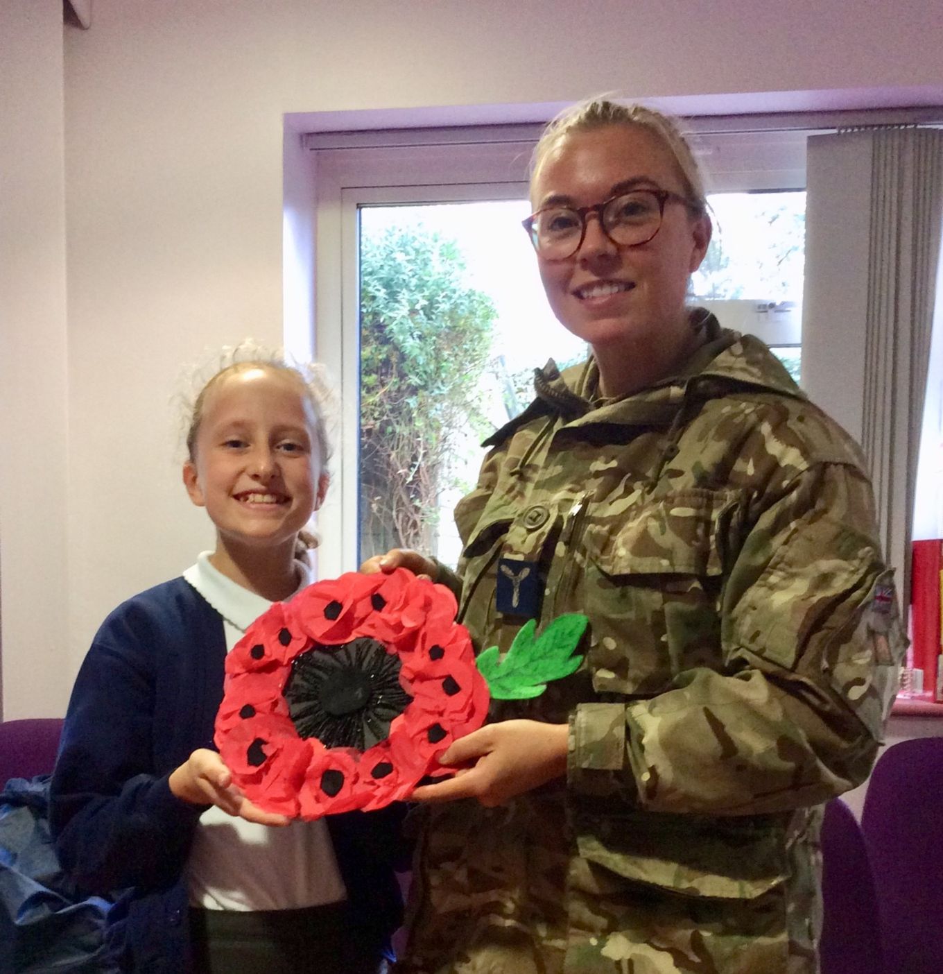 SAC Abi O’Brien and a pupil with a finished wreath.