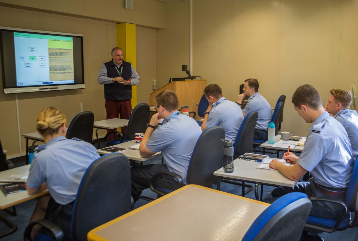 ASACS training personnel in a classroom based lecture. 