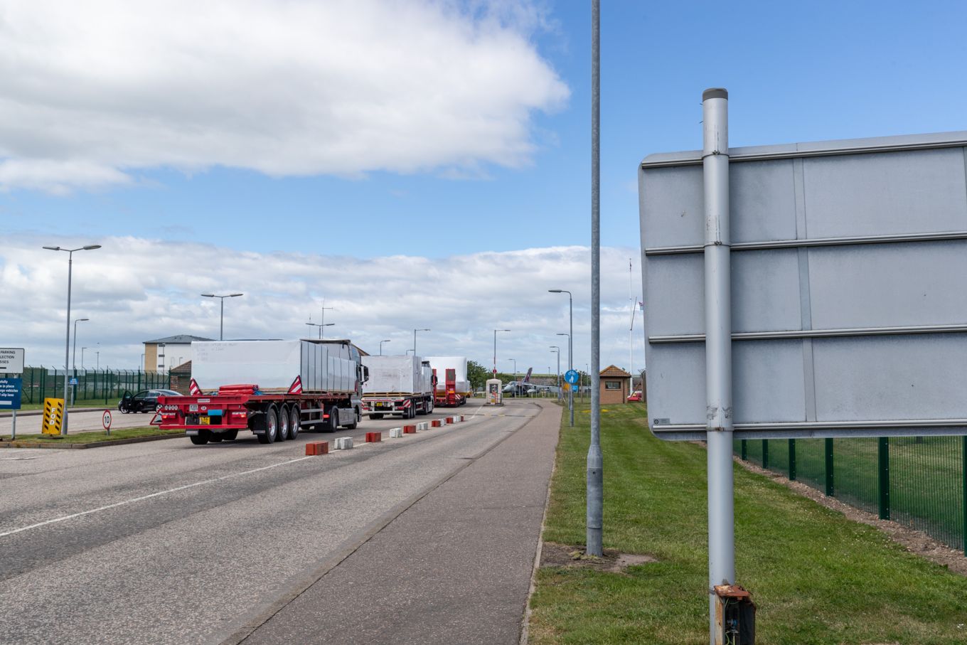 Three trucks entering RAF Lossiemouth.