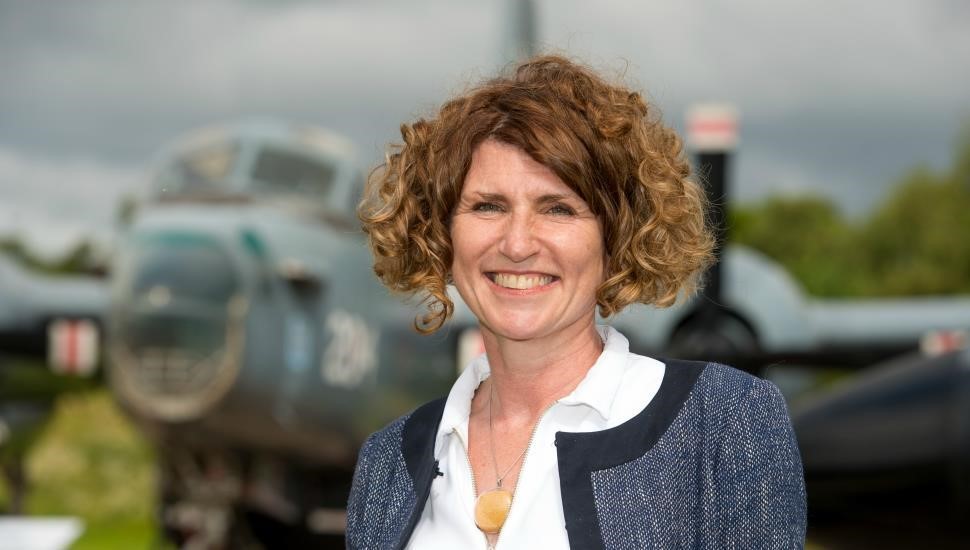 Portrait of a smiling Maggie Appleton, CEO of the RAF Museum. 