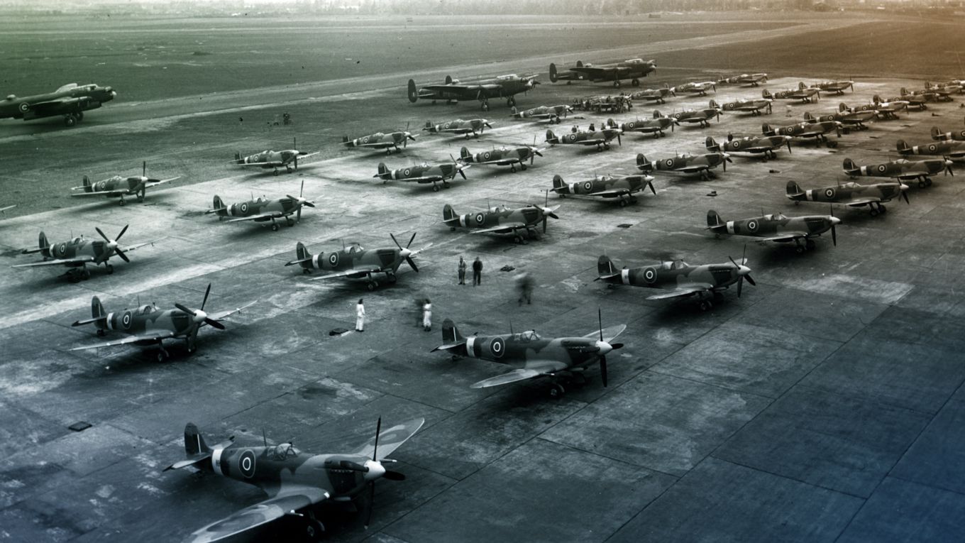 Black and white image of the Secret Spitfires lined up on the airfield. 