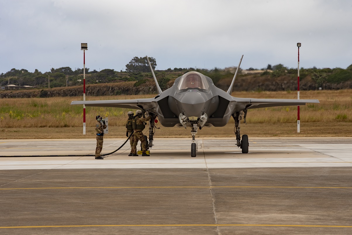 F-35 Lightning being refuelled by three personnel on the ground. 