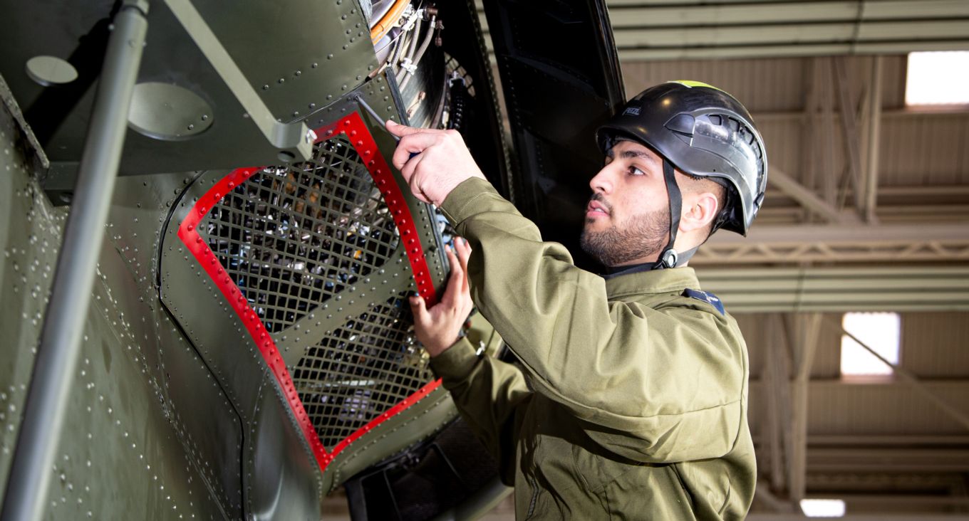 Image shows an RAF helicopter engineer.