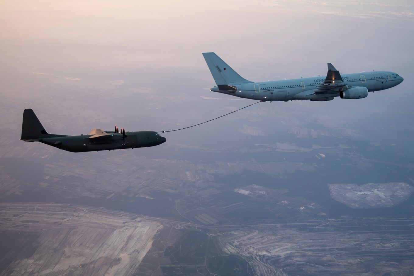 A C-130J Hercules operated by 47 Squadron, conducts Air-to-Air Refuelling from the RAF’s Voyager