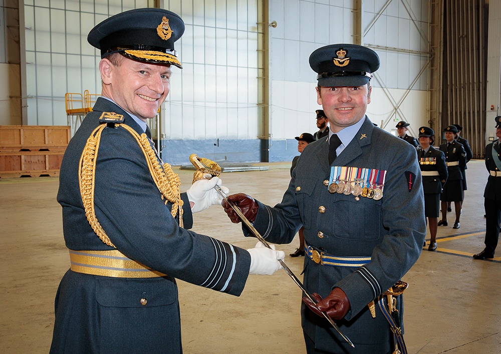 The Firmin Sword of Peace is presented by Chief of the Air Staff, Air Chief Marshal Wigston to Flight Lieutenant Blayney on behalf of Tactical Medical Wing