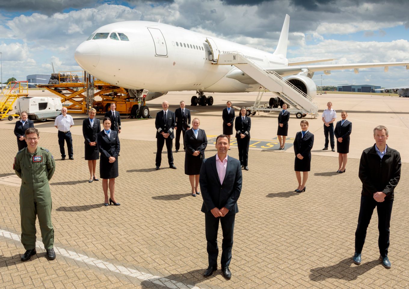 A group, socially-distanced, photo of the record breaking crew, and others involved
