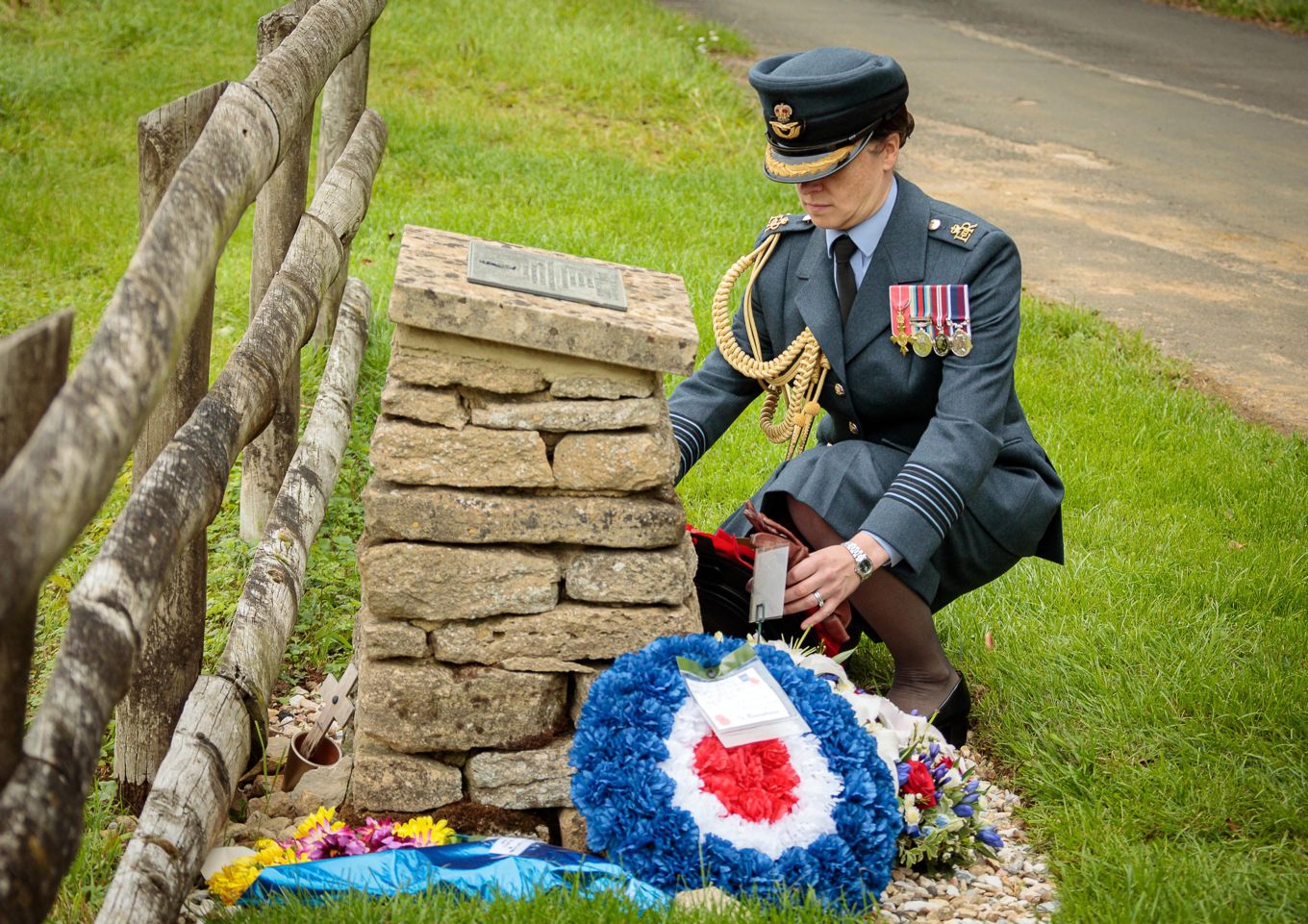 Group Captain Emily Flynn lays a wreath at the memorial cairn, in commemoration of the Albemarle crew