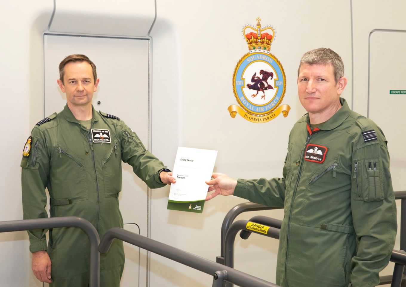 Squadron Leader Brandon being awarded an RAF Green Endorsement safety award by Commander Air Wing, Group Captain Blackwell at XXIV Squadron