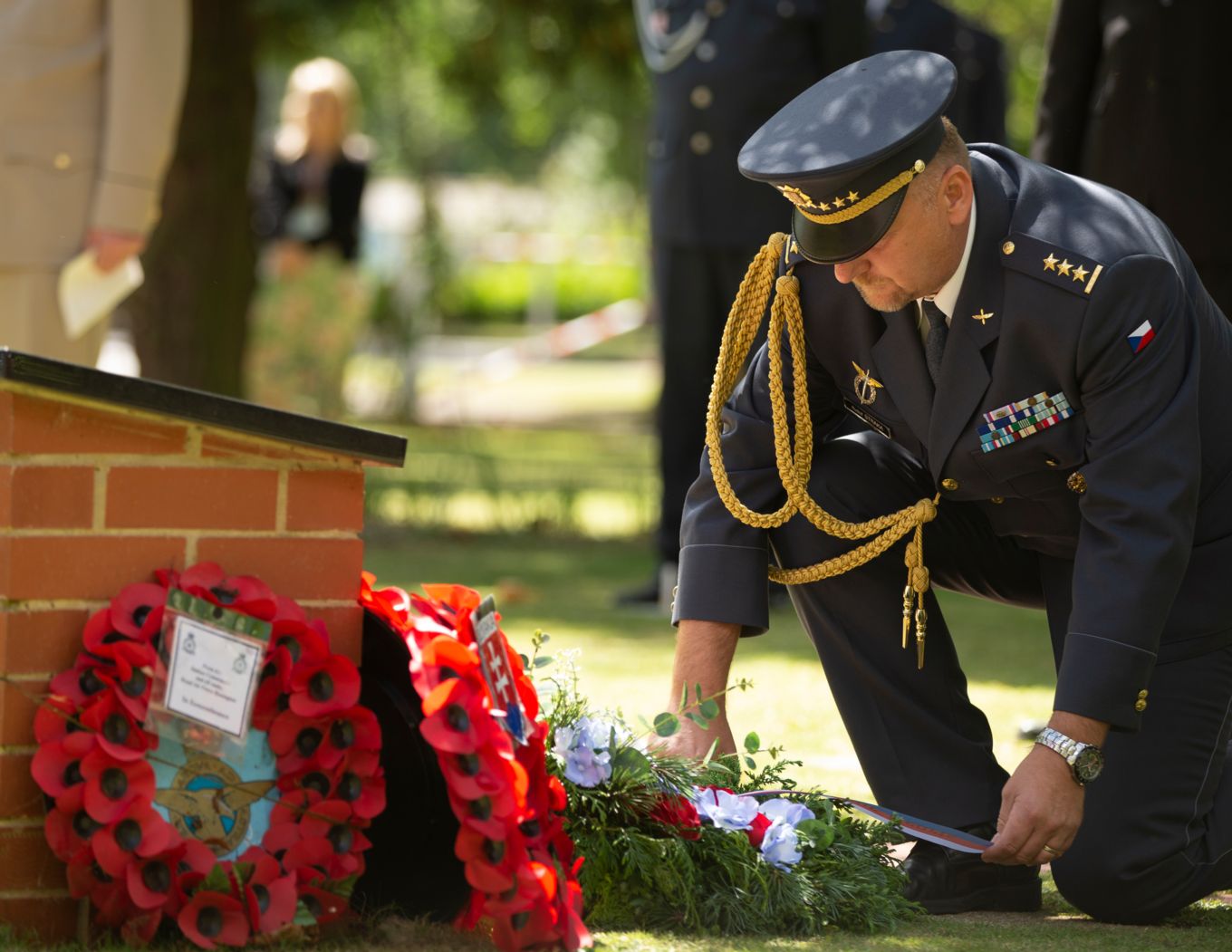 Col Gen Staff Straka, Commander 22 HAB Namest, lays a wreath at the station memorial 