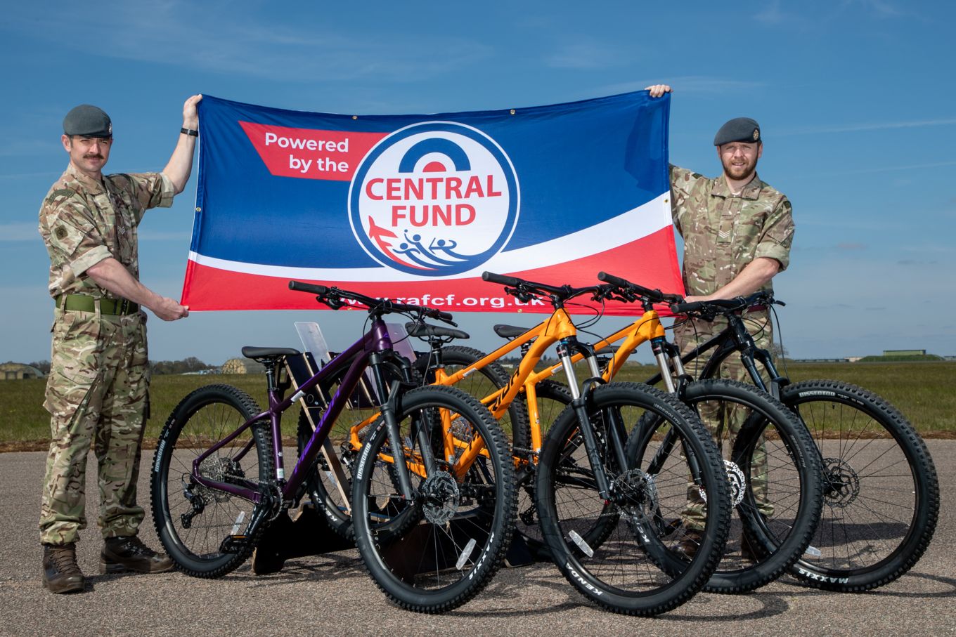 RAF honnington personnel pose for photo with RAF Central Fund flag