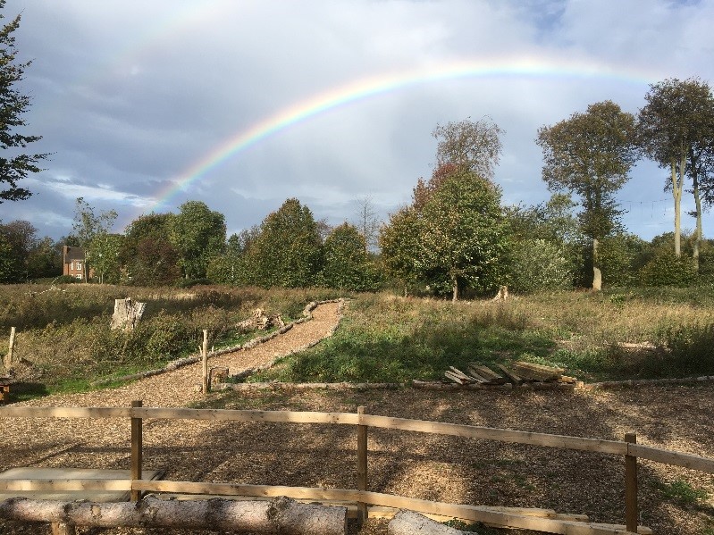 Nature trail at RAF Marham with a rainbow in the background. 