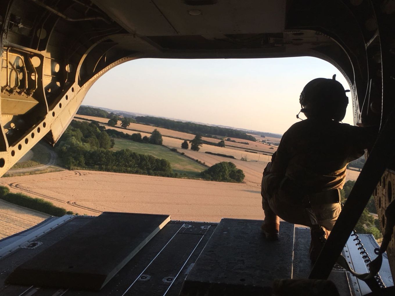 Flt Lt Katie Morris on the ramp of a Chinook over Surrey