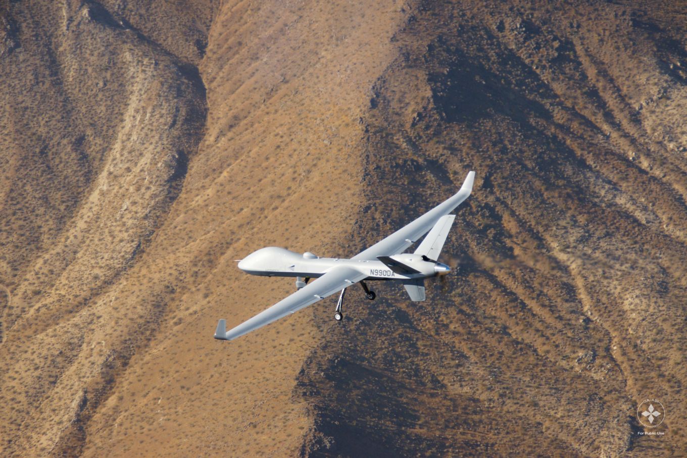 Image shows the Protector aircraft flying above land.