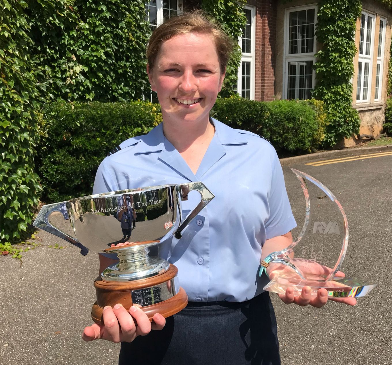 Flight Lieutenant Danielle Rowe with the official silver trophy and personal award