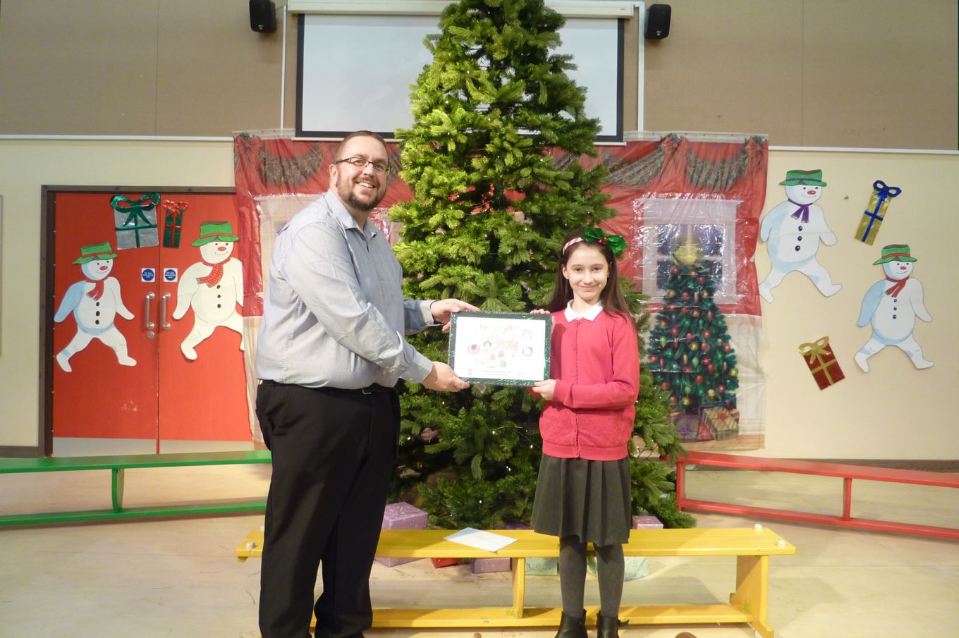 Head Teacher Rhys Thrower with winning student Gabriella McAulay