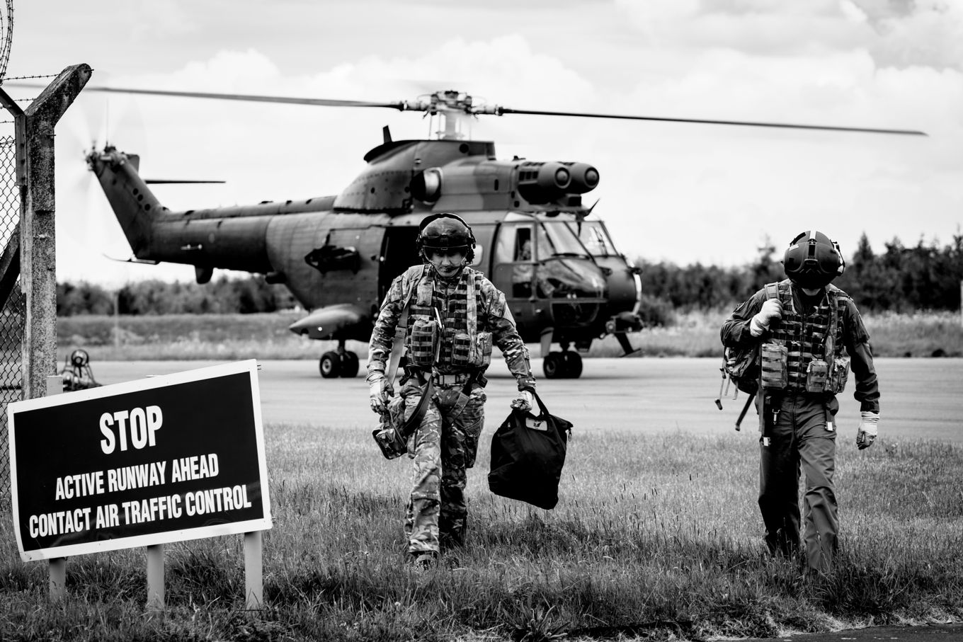 Ground Crew walking from a Puma Aircraft
