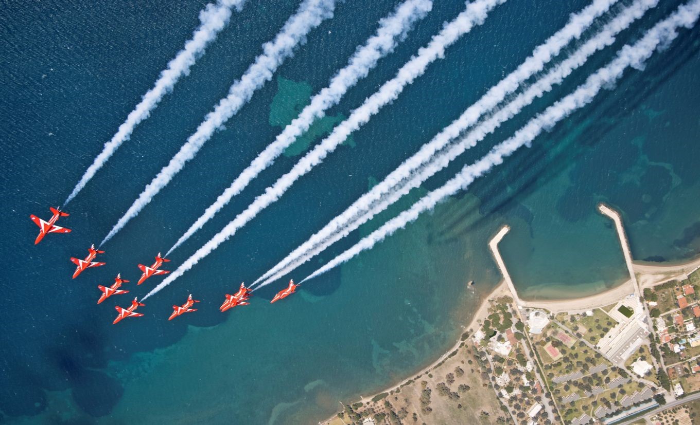 Red Arrows and white trails flying.