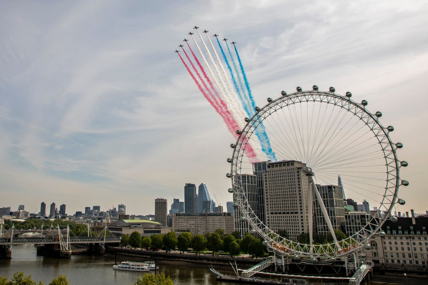 The Red Arrows conduct a fly past over London this morning as part of the 75th Anniversary of Victory in Europe.