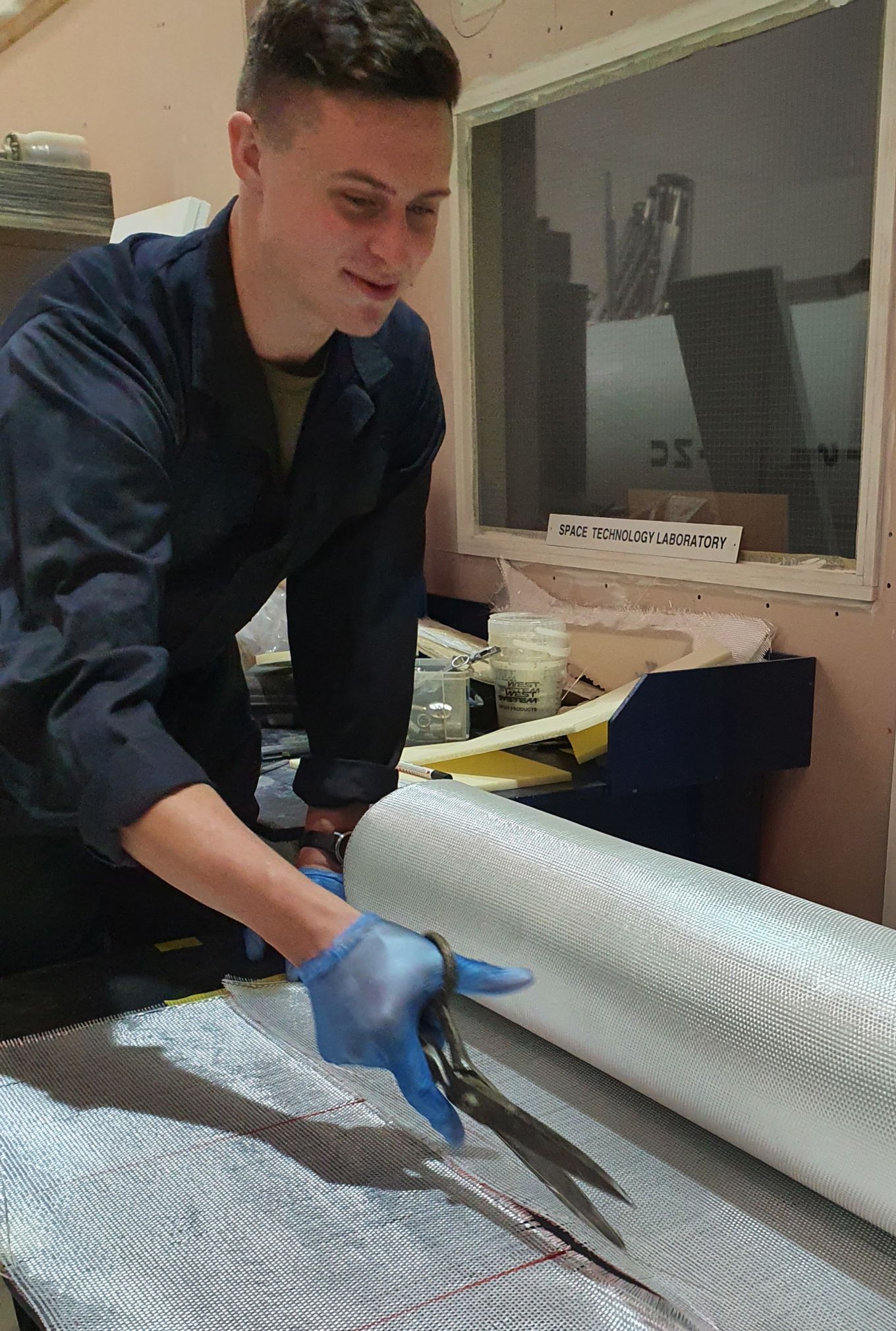 SAC(T) Luke Marston working with composite materials at Starchaser Industries