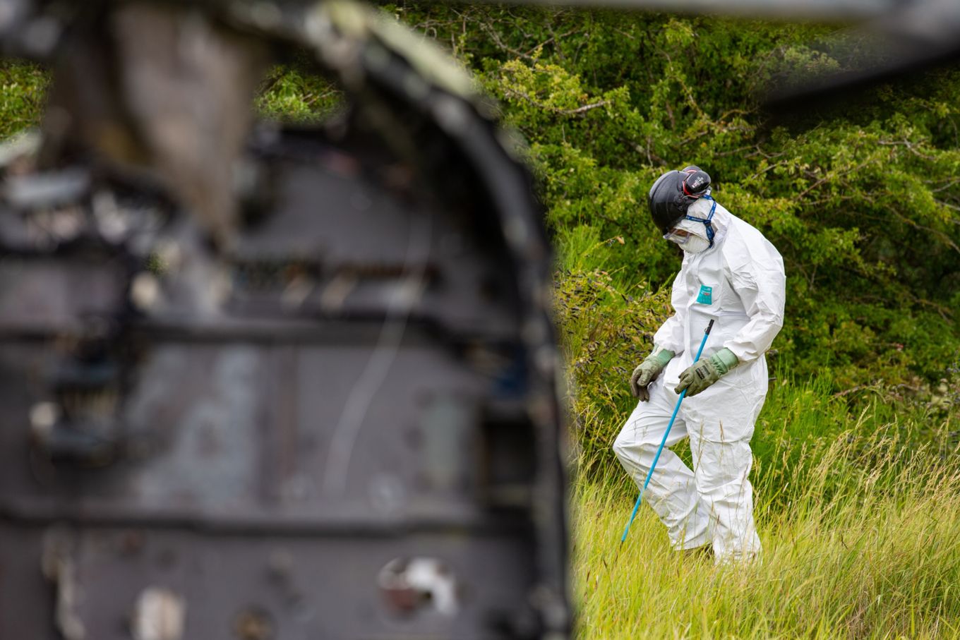 A member of the JARTS team conducting a detailed search