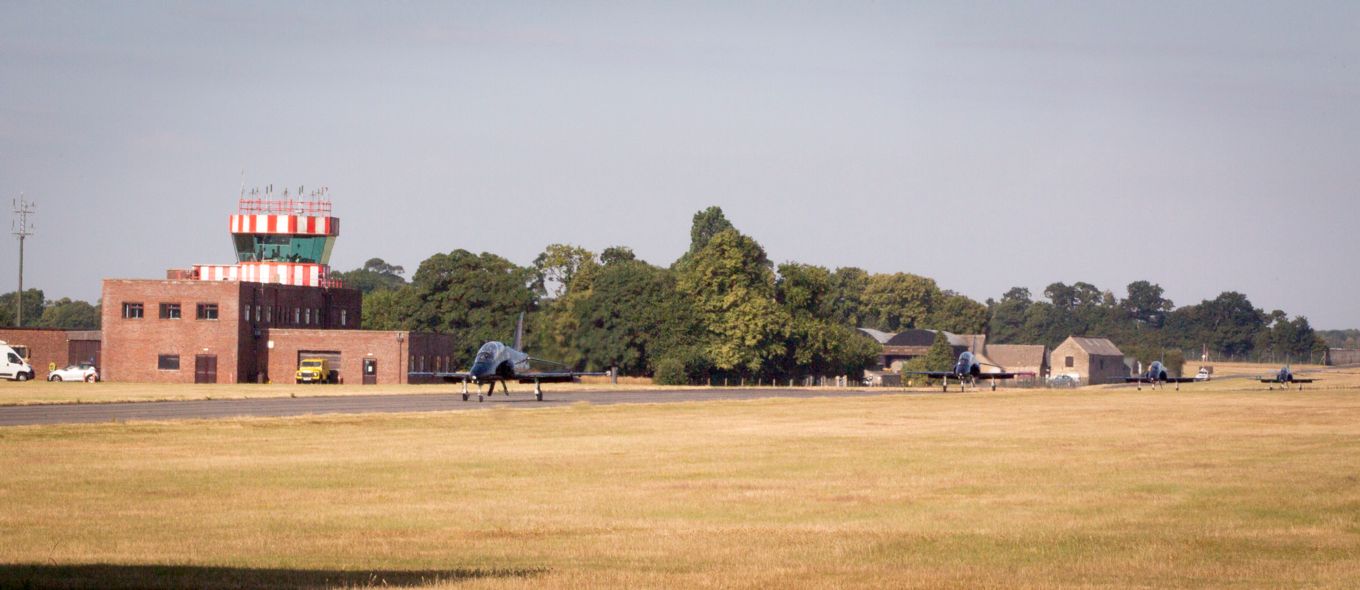 RAF Hawk jets arrive at Wittering in advance of the RAF 100 flypast. The Air Traffic Control tower can be seen in the background