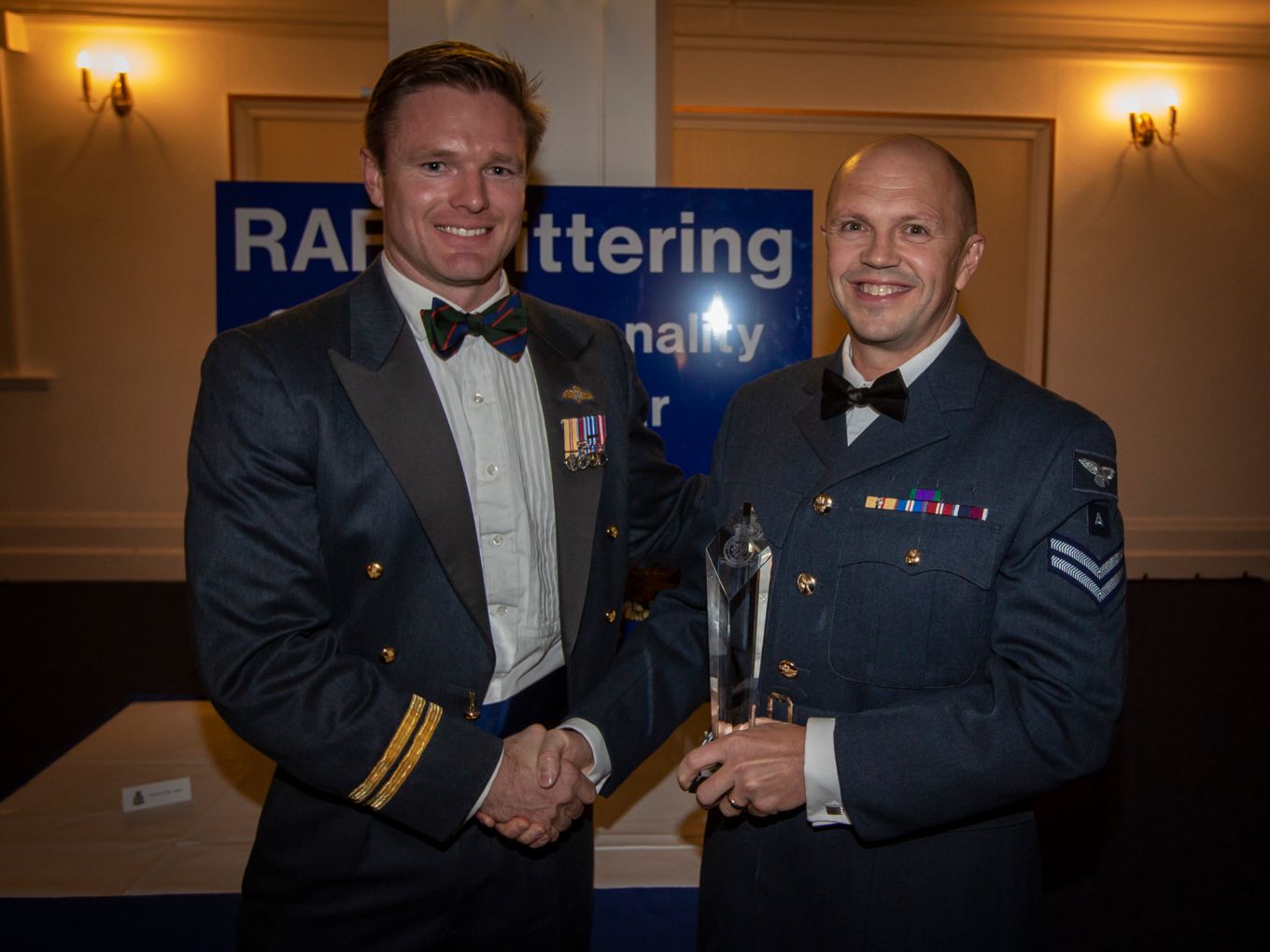 Flt Lt Nathan Jones presents the Coach of the Year award to Cpl Carl Hickman