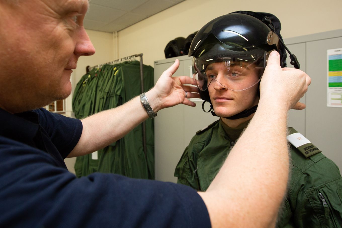 Student Jamie Morley is fitted with a flying helmet
