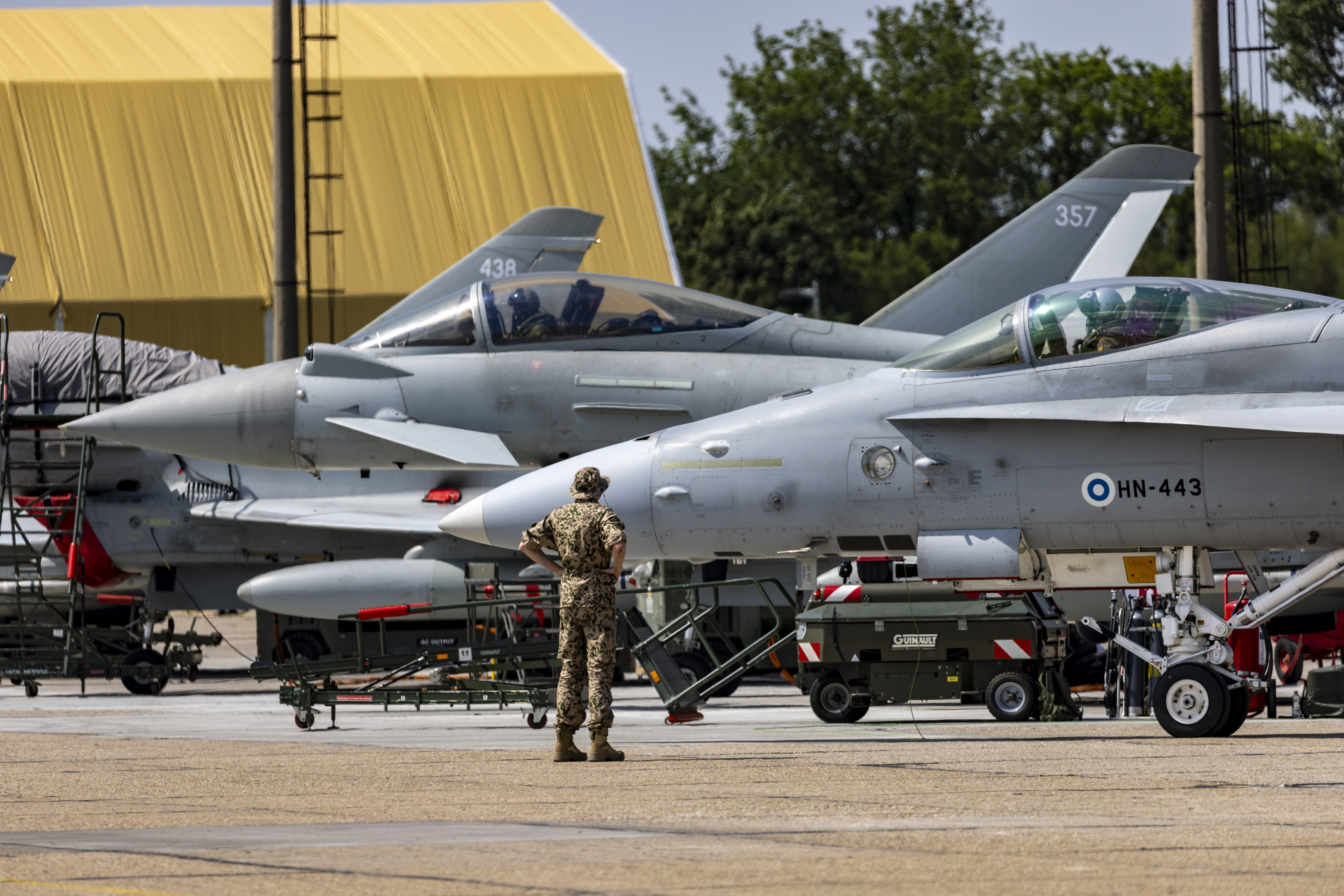 RAF Typhoon and Finnish Air Force F-18 together on the ground.