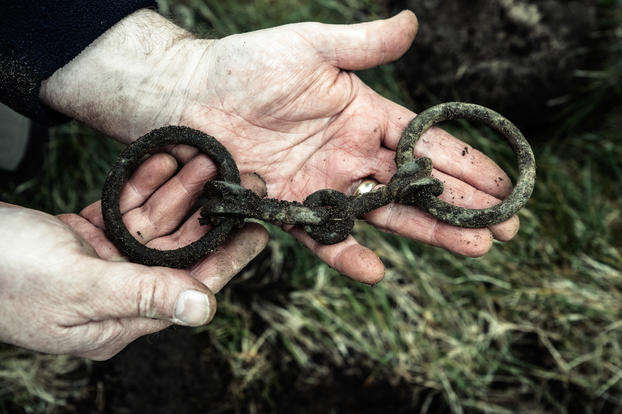 Bridle-bit from the find being held by one of the diggers.